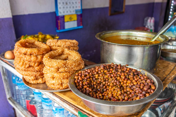 https://media.istockphoto.com/id/1320652640/photo/nepalese-food-breakfast-with-sel-roti-and-chickpeas-in-kathmandu-nepal.jpg?s=612x612&w=0&k=20&c=nVFHKlsAQITDKnYpnYfKsuJIzXXyMm2zIw-C_fmMvPw=